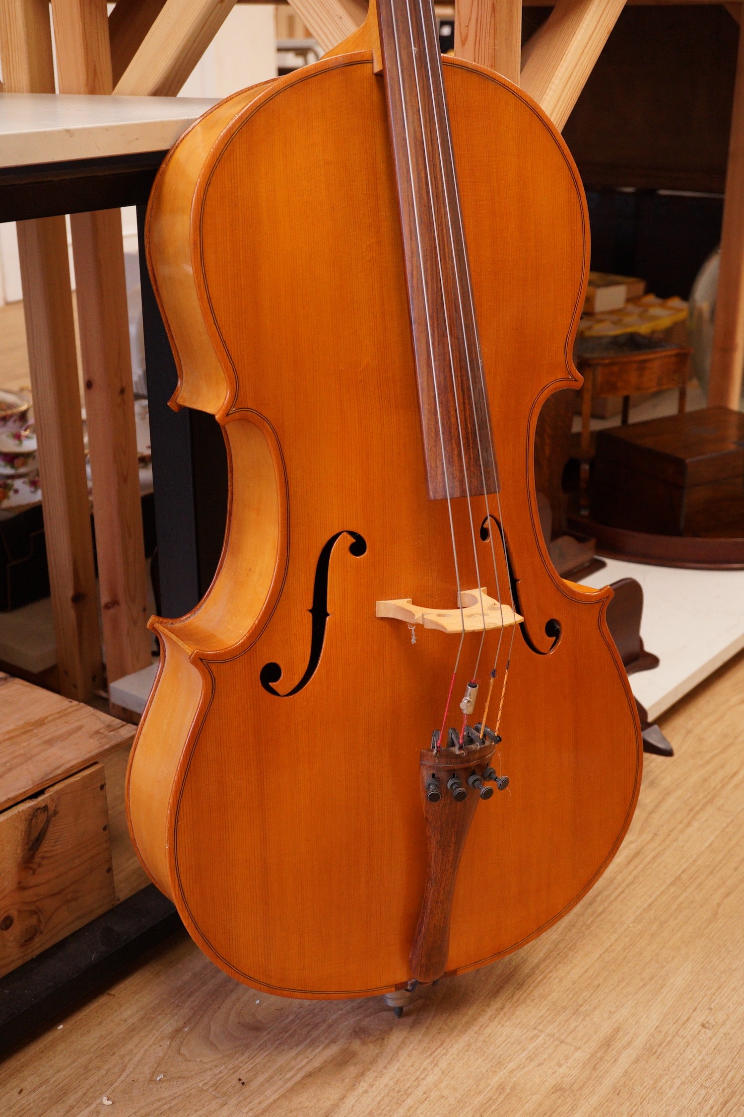 A cello and bow, back measures 73cm